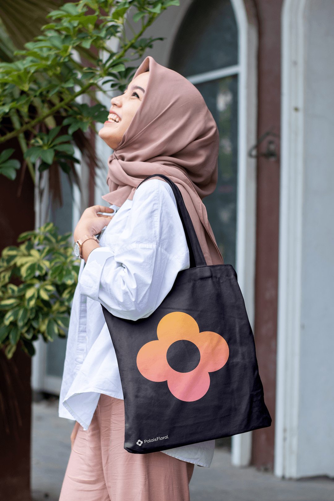 A mockup of a tote bag with the logo on it.
